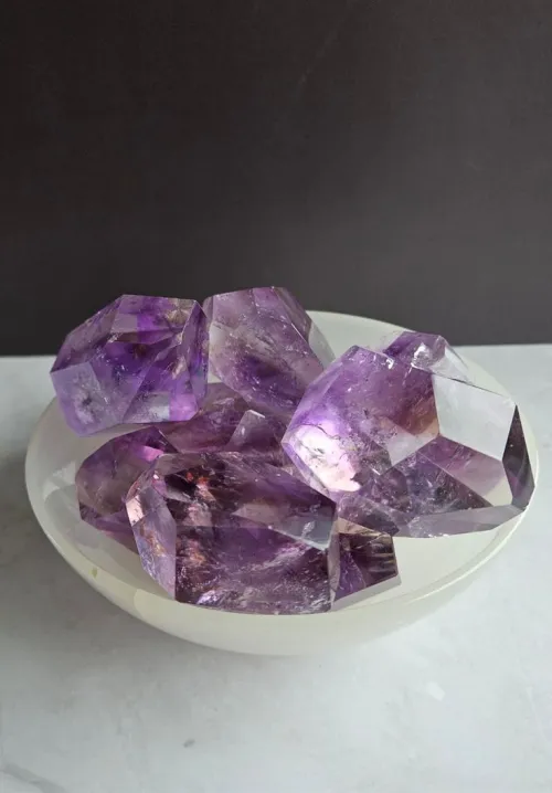 Amethyst geode cross-section revealing color variations