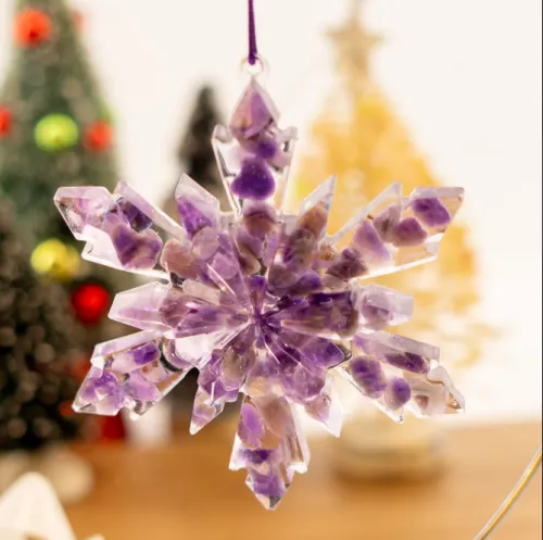Polished and raw amethyst ornaments contrasting on pine branches